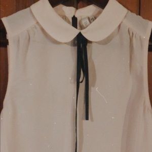 Cream blouse with black neck tie